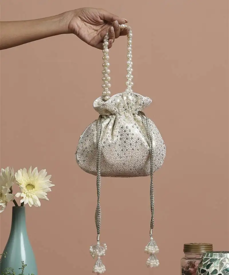 White georgette with silver sequin potli bag