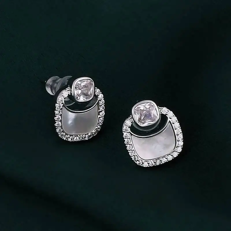 Classy round shape studded cz silver plated stud earring for women and girls