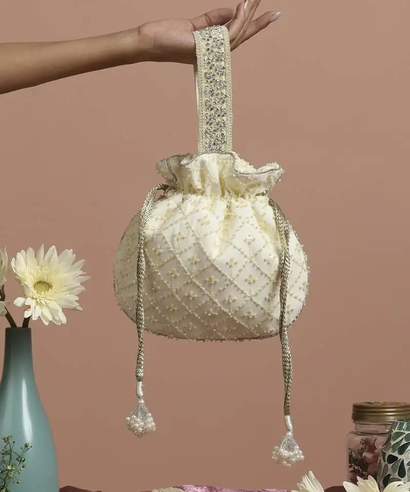 Yellow pure chinon with cutdana potli bag