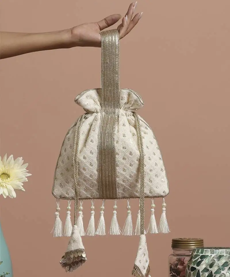 White georgette with gold sequin potli bag