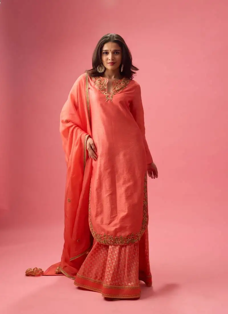 Rose silk plain kurta paired with skirt and dupatta