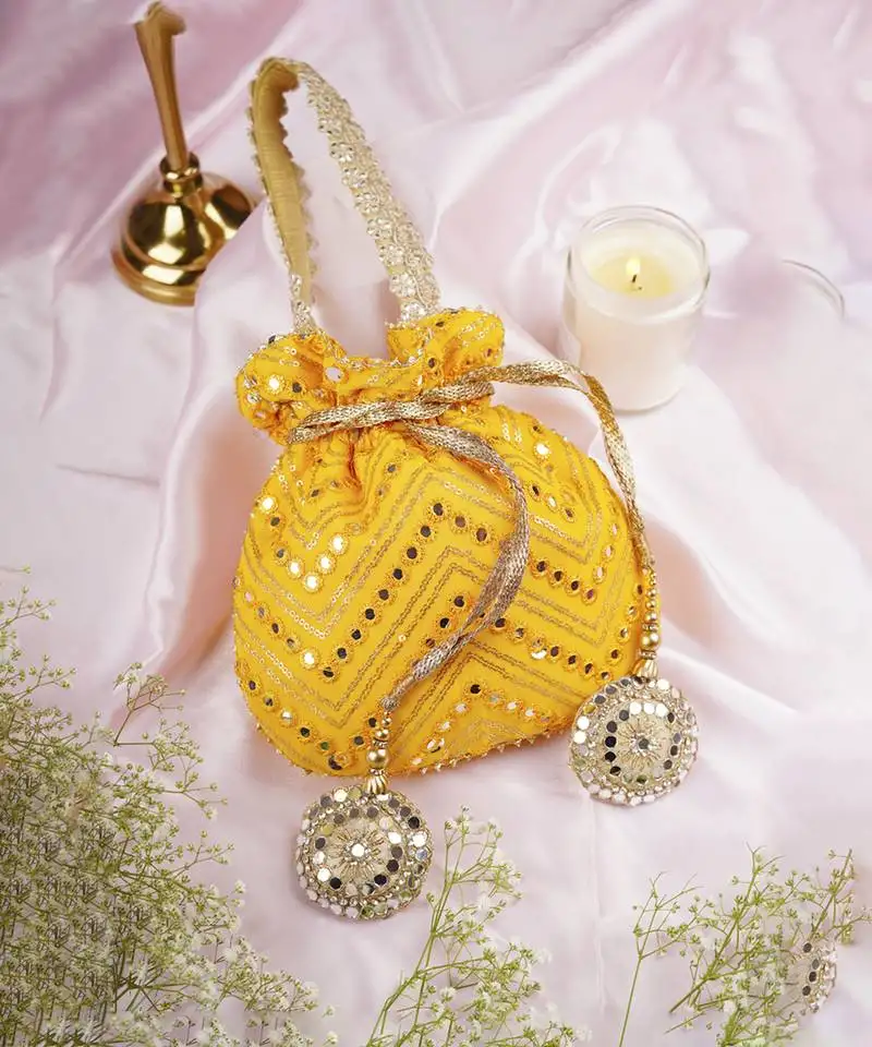 Yellow georgette with mirror work potli bag