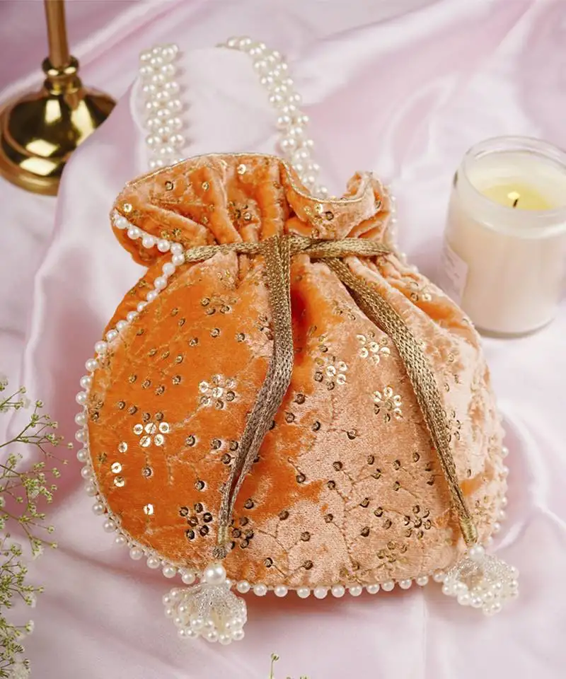 Peach velvet with embroidery potli bag