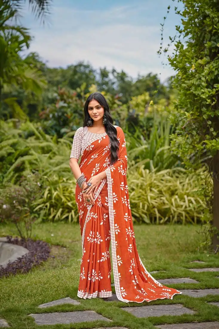 Orange cotton floral print saree with printed blouse piece