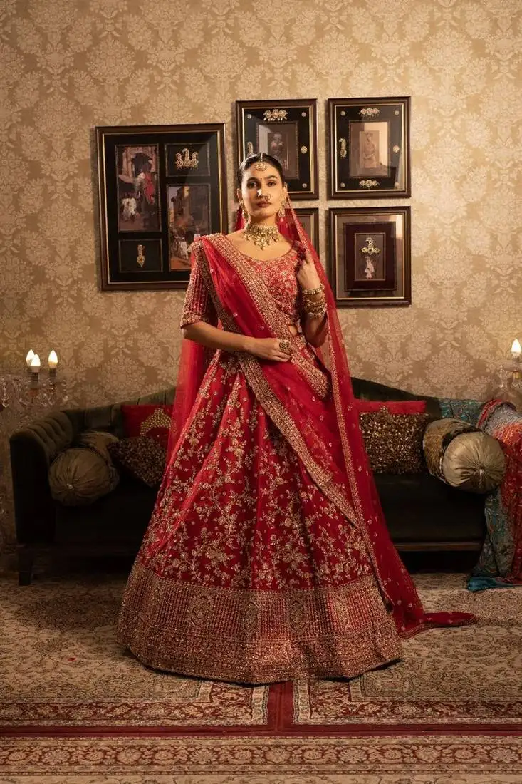 Red silk bridal lehenga with floral motifs sequins and cutdana embellishment