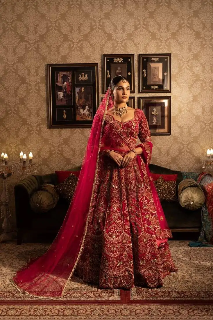 Maroon velvet bridal lehenga with heavy embroidery