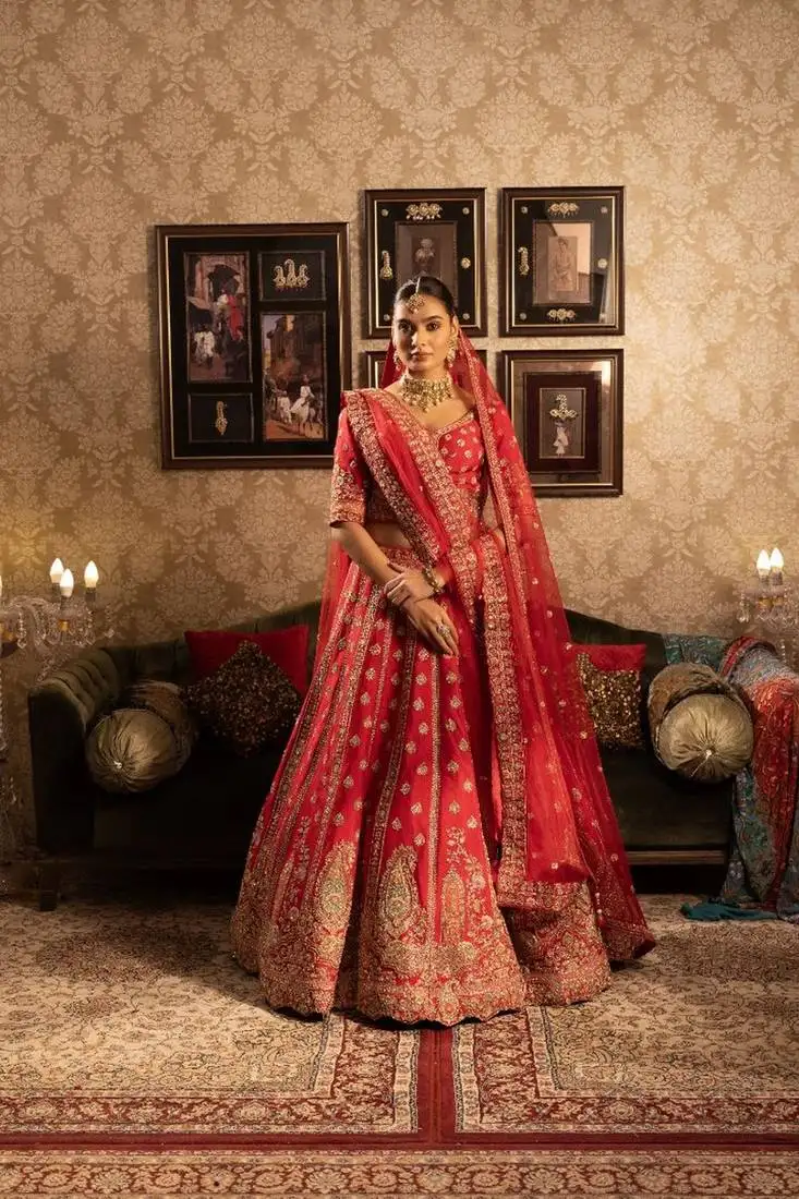 Red silk bridal lehenga with paisely butis