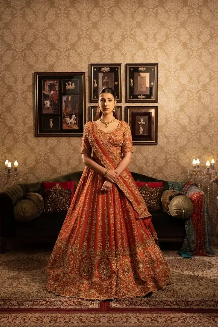 Rust bridal lehenga with cutdana sequins embellishment and double dupatta