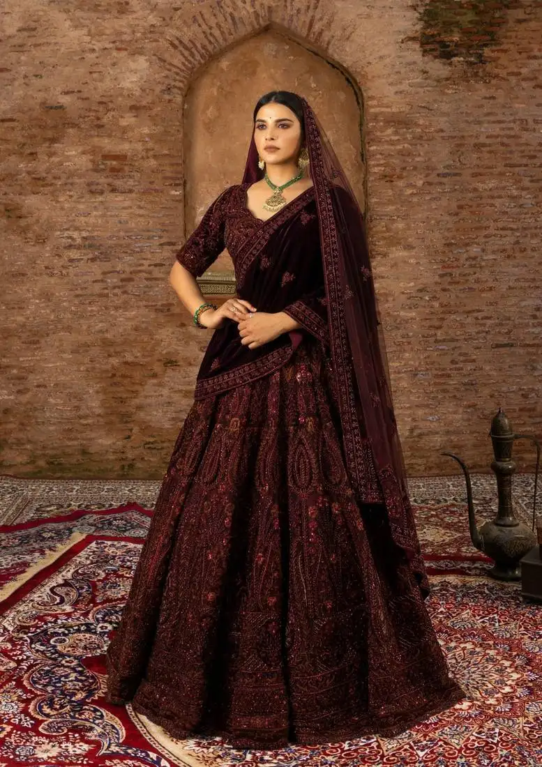 Maroon bridal lehenga in net and velvet with hand-embroidery