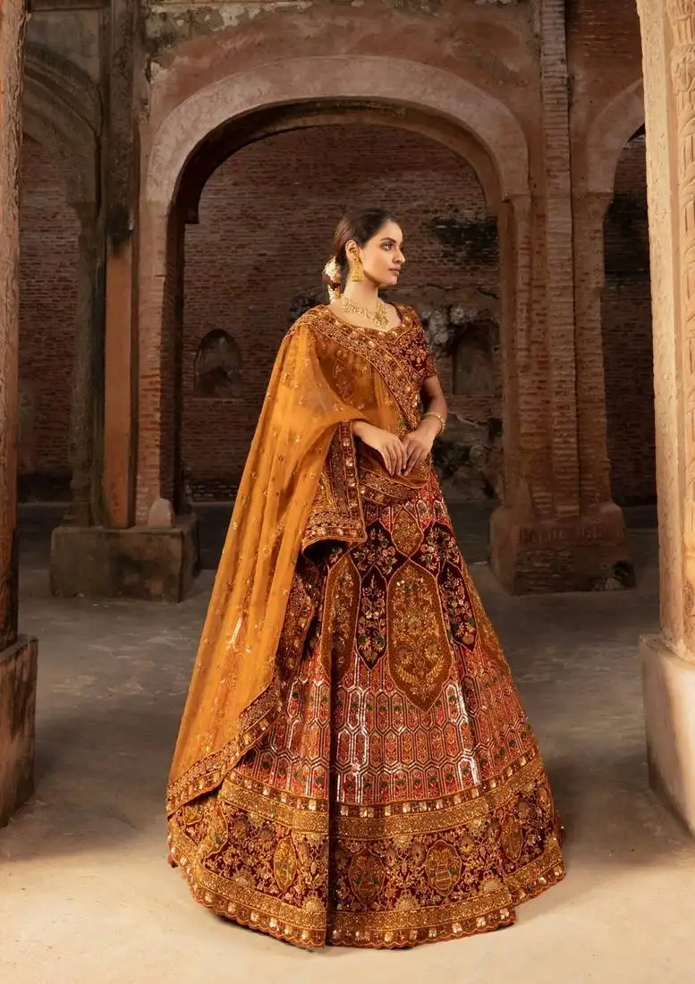 Rusted silk bridal lehenga with sequins and delicate floral motifs