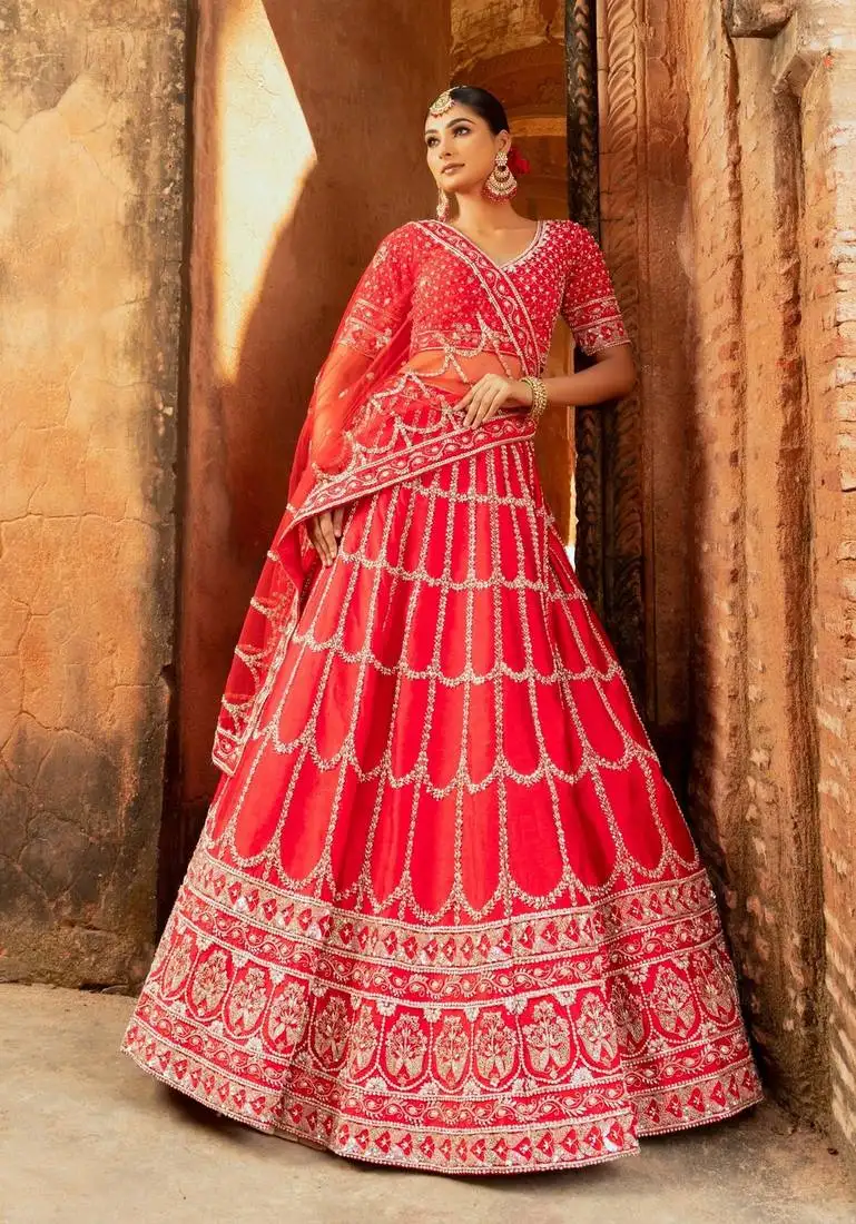 Red silk lehenga with pearl and zardozi embellishments