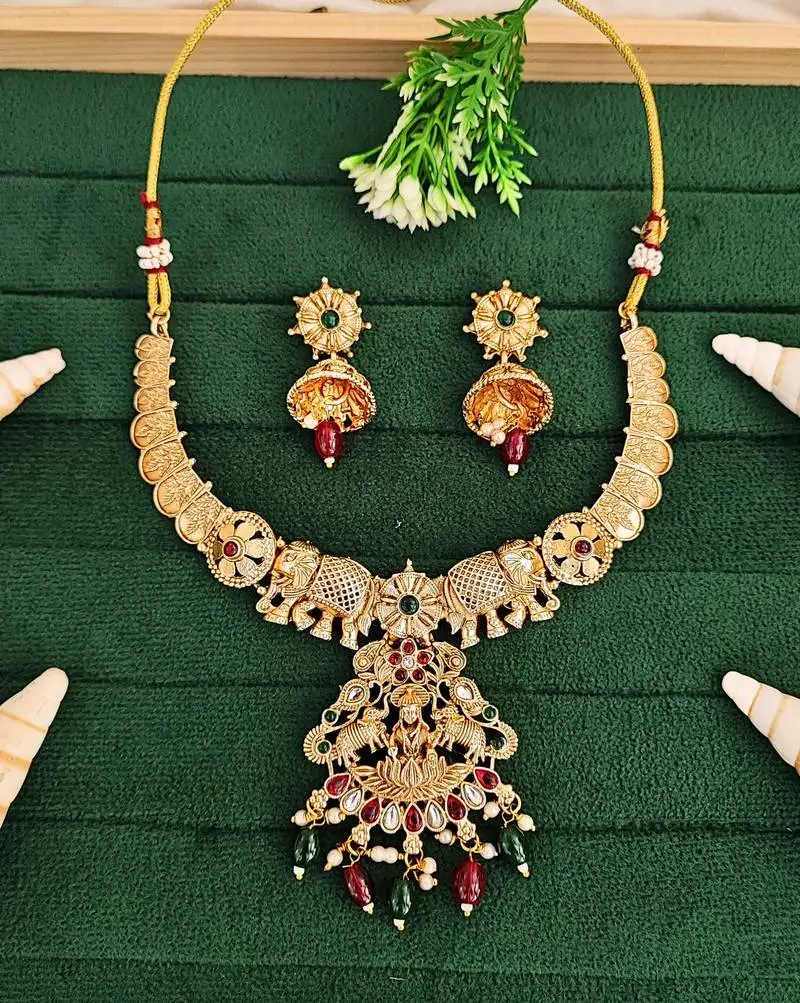 Gold plated elephant motif necklace set with red & green stones and jhumka earrings - elegant indian jewelry.