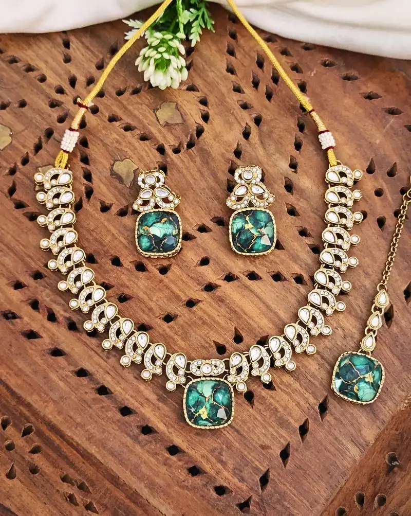 Kundan necklace set with green stones, earrings & maang tikka   mehendi polish  color may vary
