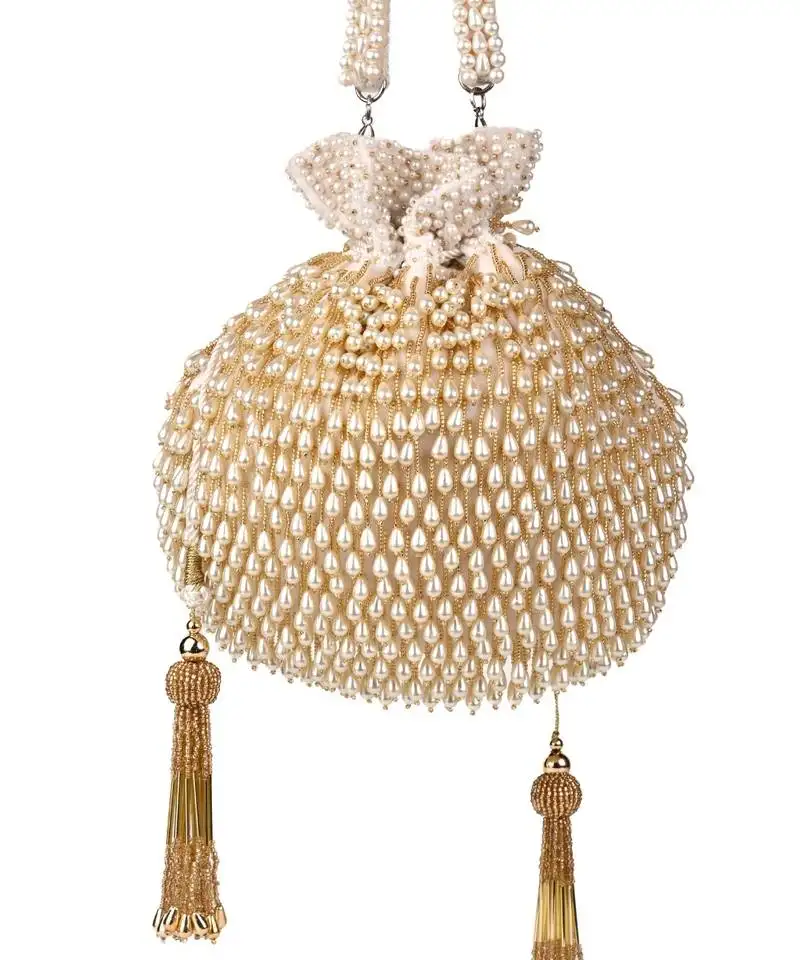 Adara ivory suede potli with pearl gold hanging