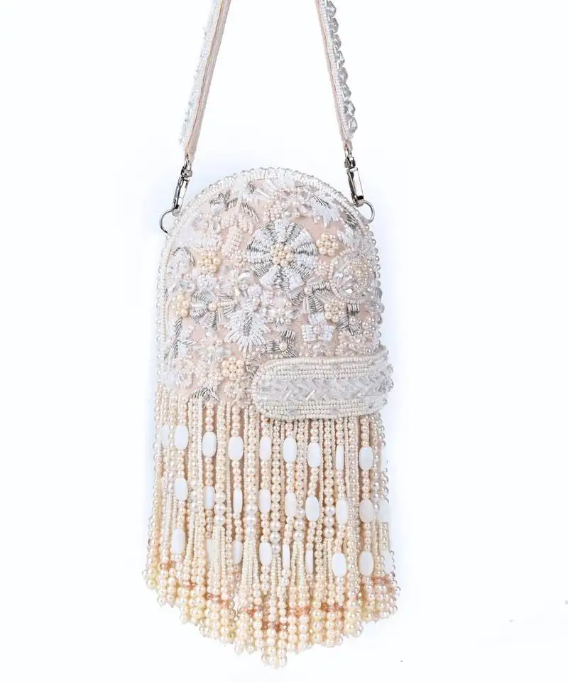 Azmat ivory suede embellished capsule bag