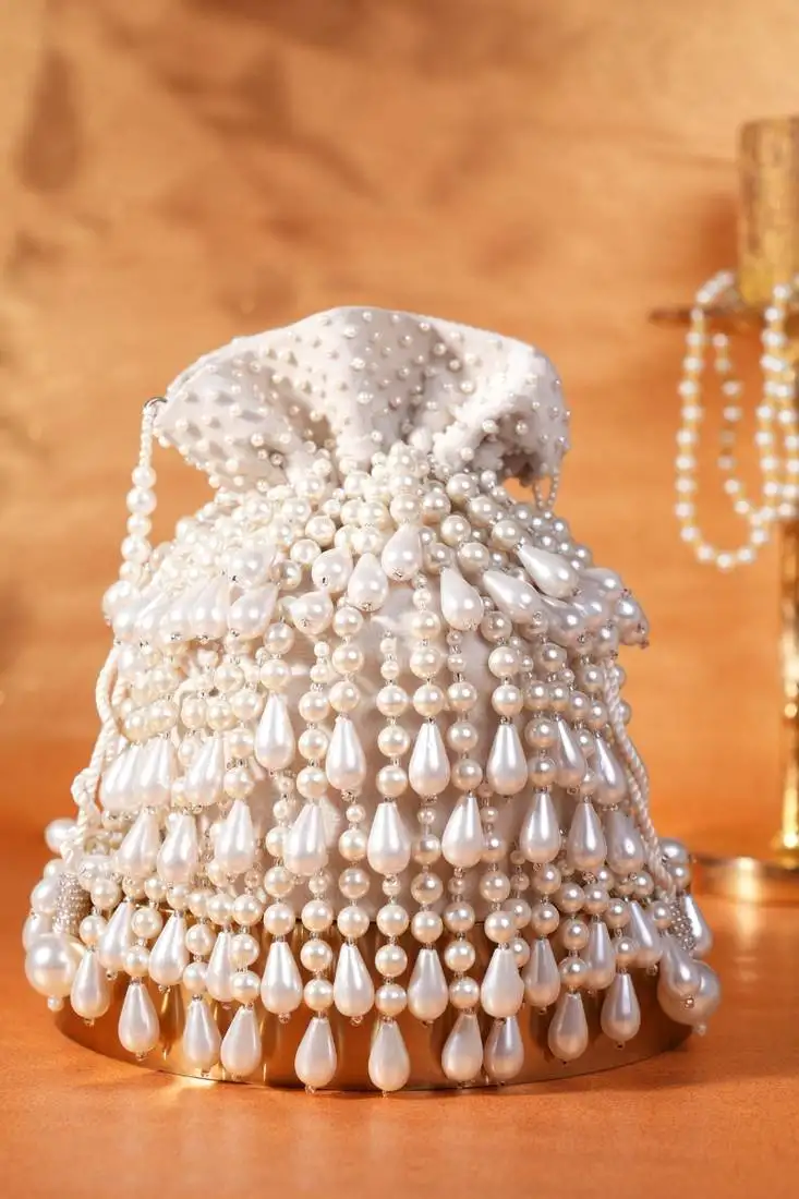 Zarah ivory pearl suede bucket bag