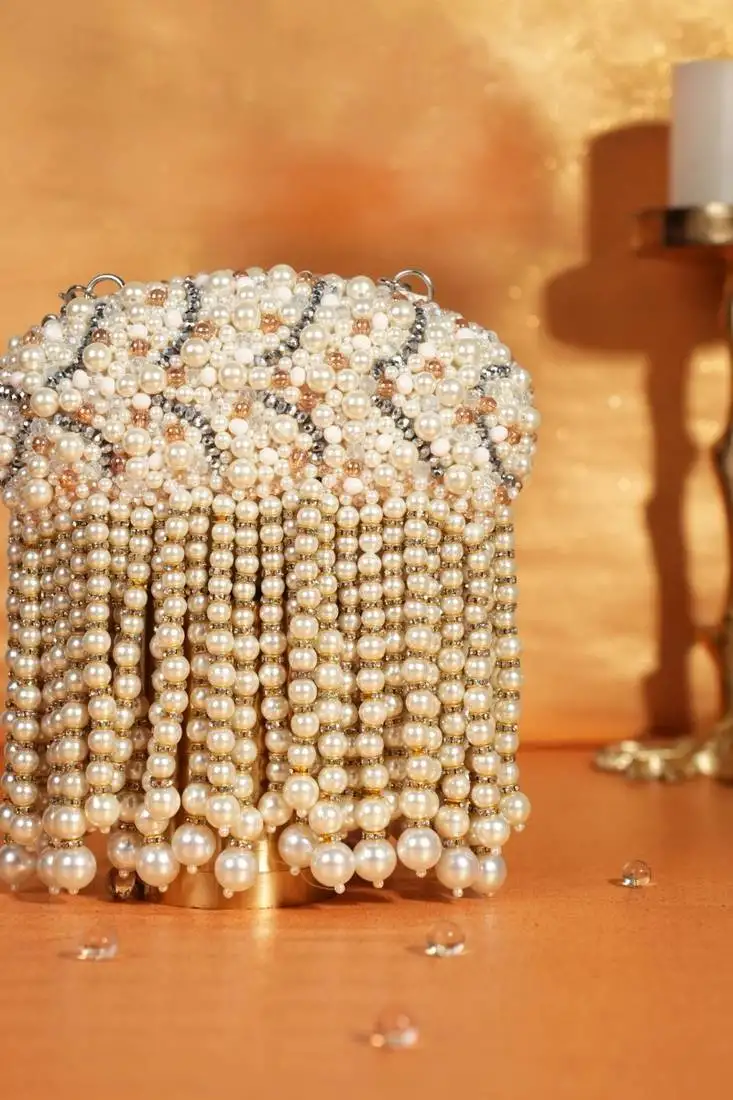 Chloe ivory suede clutch with big pearl hanging