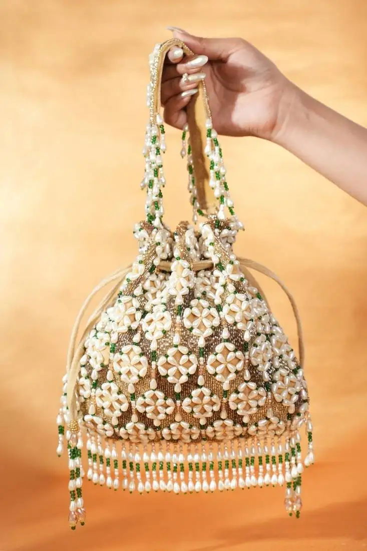 Falak gold suede embellished potli