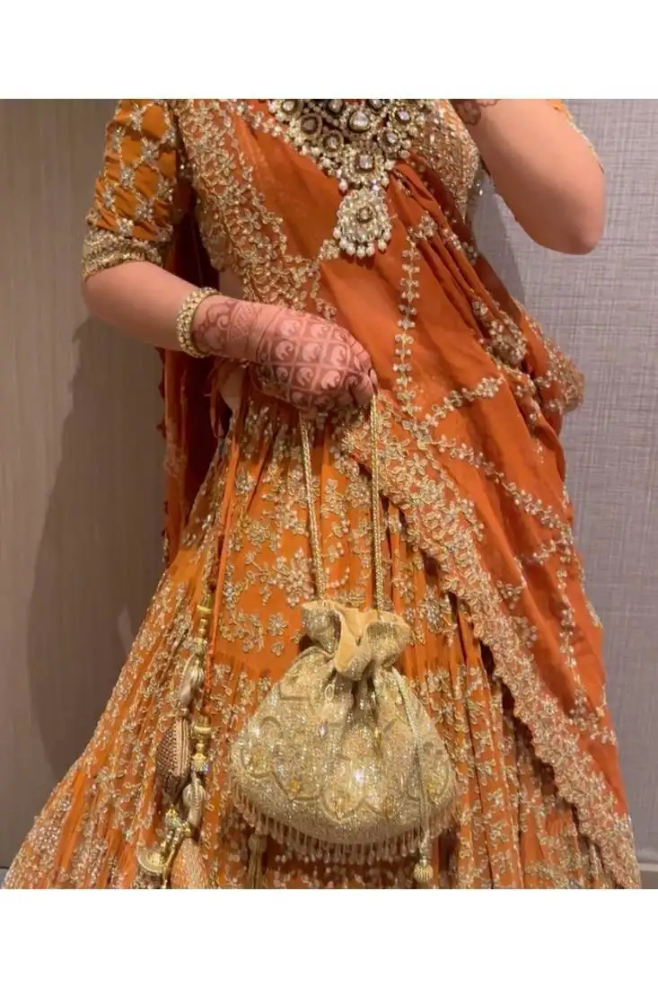 Sunheri gold and silver georgette embellished potli