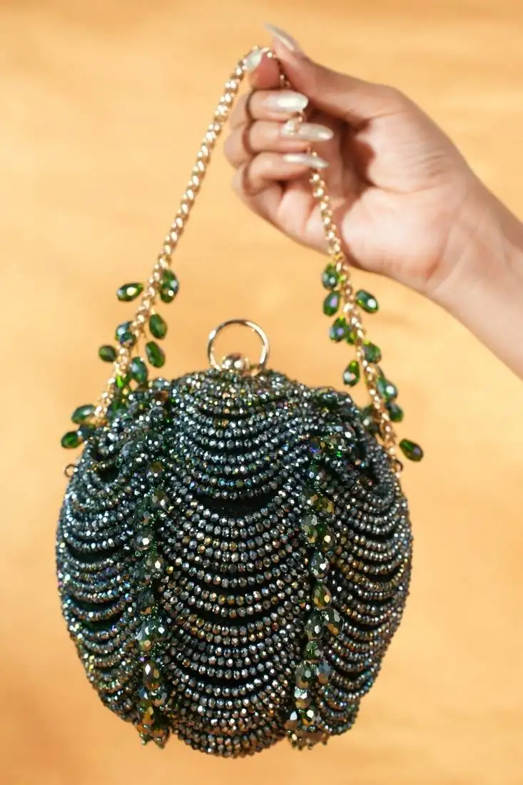 Velora green suede embellished round bag