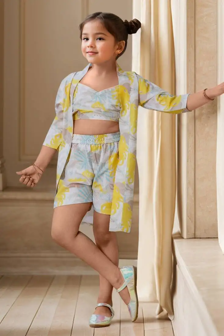 Yellow printed sleeveless crop top and shorts with shrug co-ords for girls