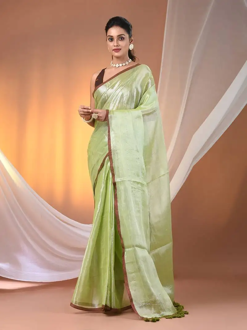 Light green tissue soft saree with pompom