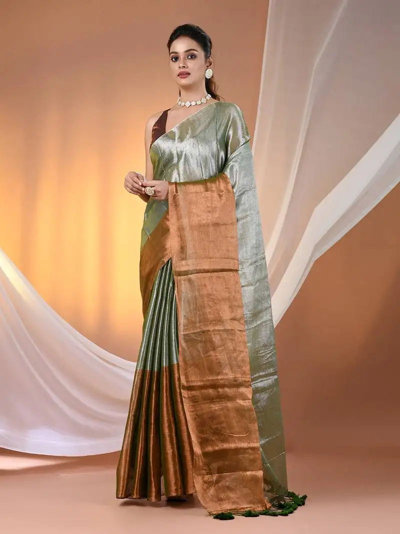 Green and golden tissue soft saree with pompom