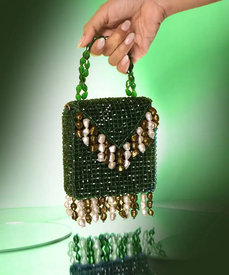 Semi velvet suede based green handbag with crystal bead work