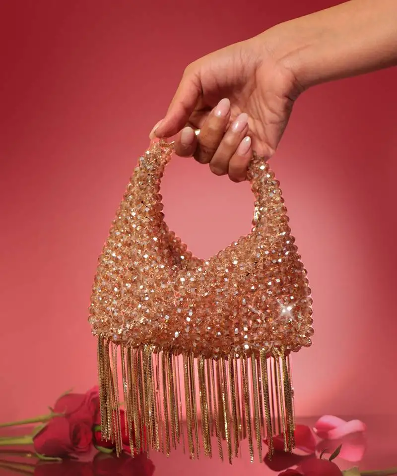 Gold potli bag with crystal work