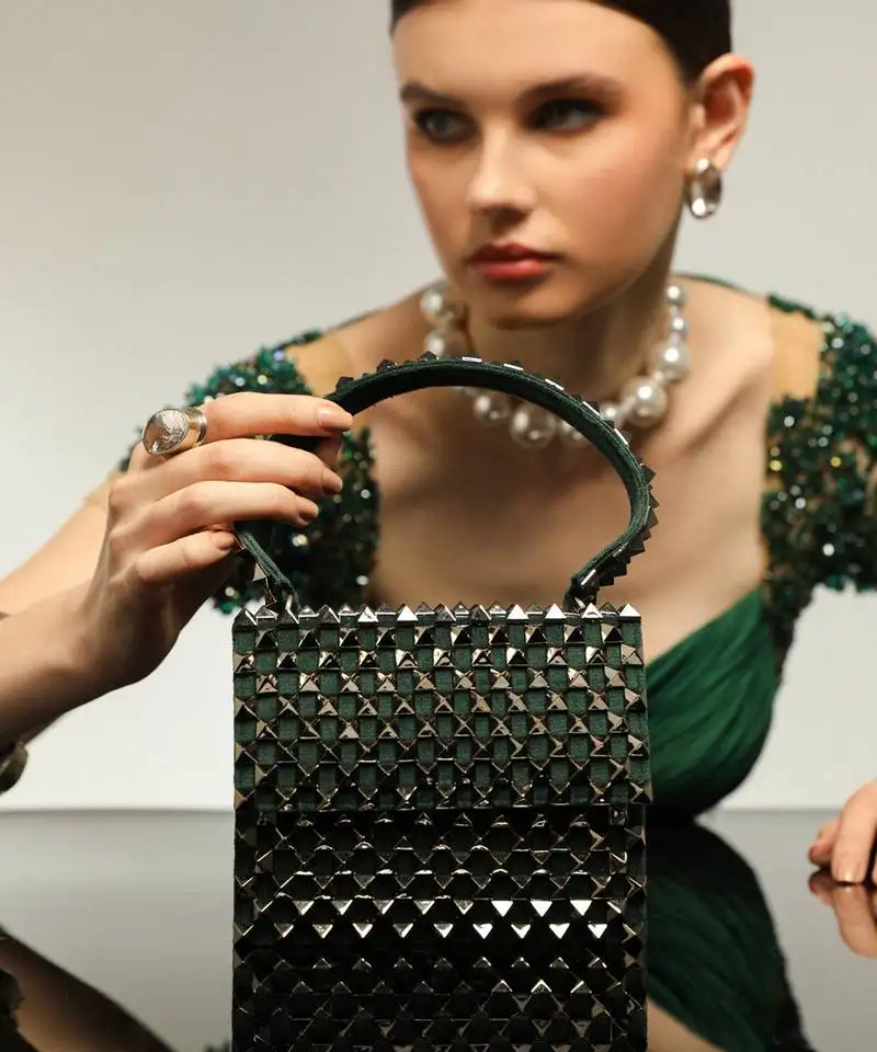 Green handfcrafted semi suede mini rivet bag