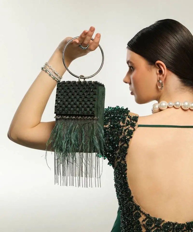 Green semi suede handbag with a gun metal chain