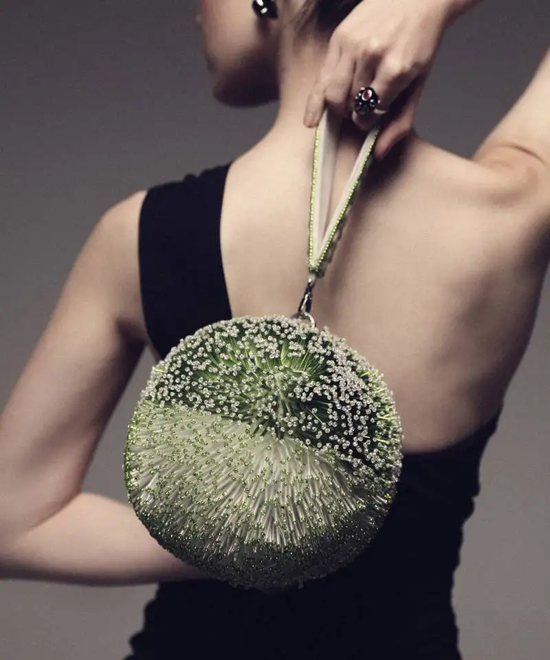 Green semi suede hand bag with pipework detailing