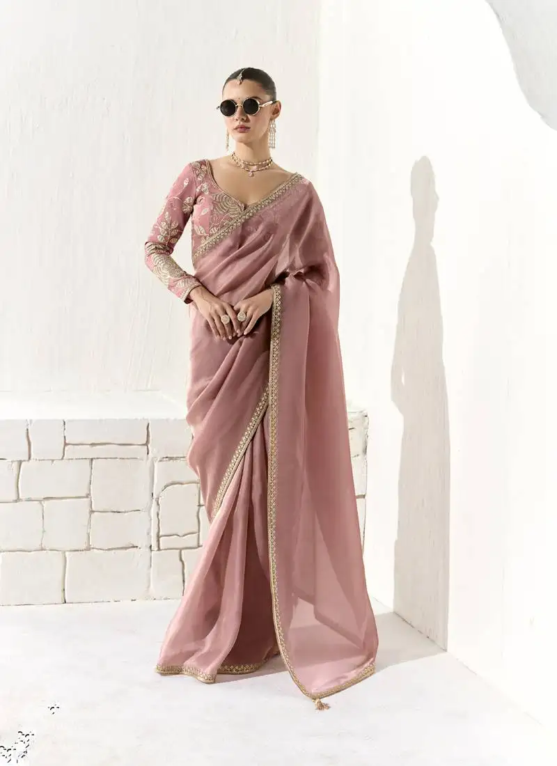 Peach glass tissue saree with sequin zari weaving blouse