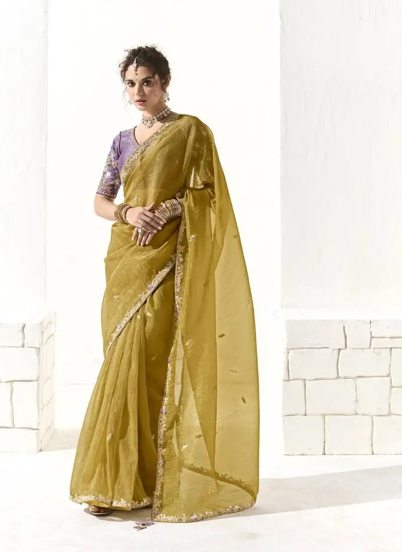 Mustard glass tissue saree with sequin zari weaving blouse