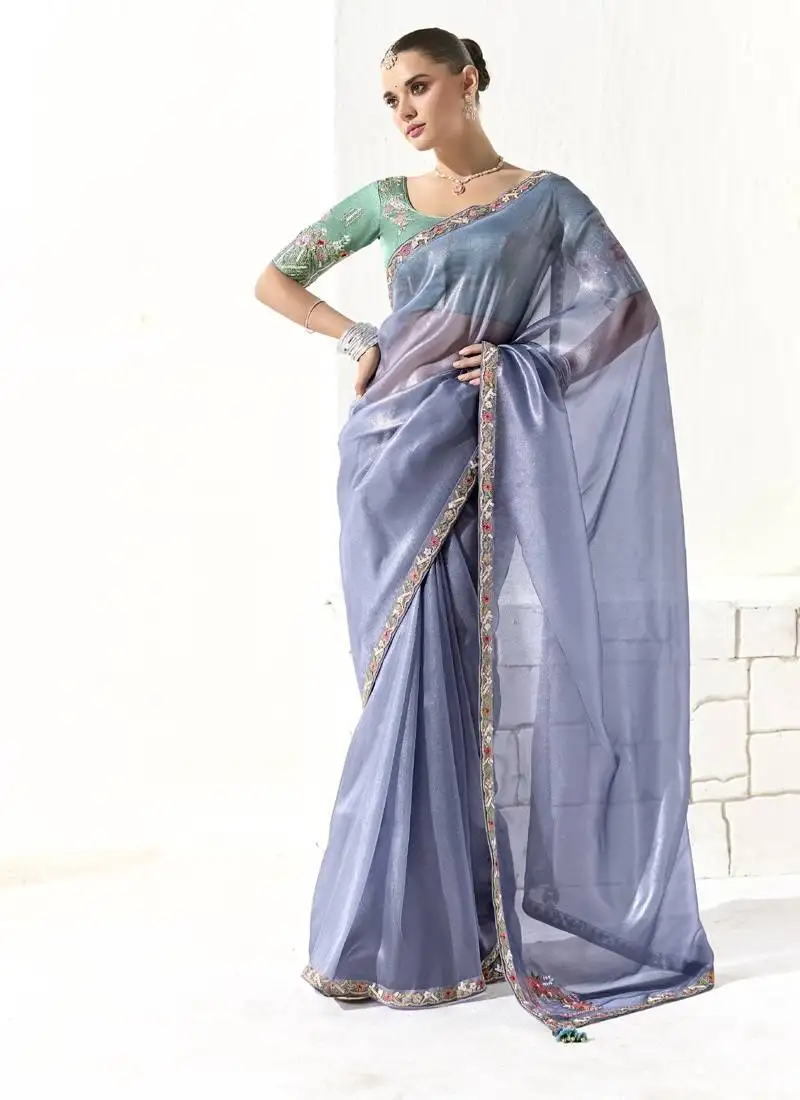 Light blue glass tissue saree with sequin zari weaving blouse