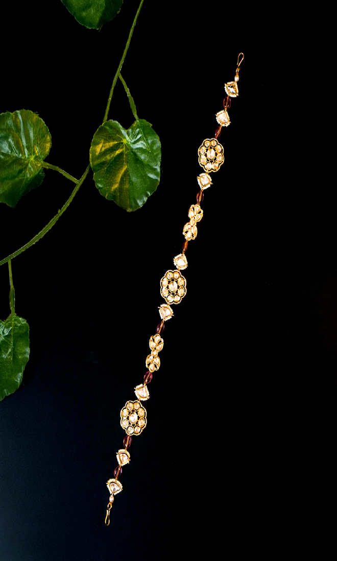 Elegant kundan floral matha patti with bead accents