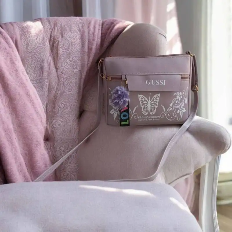 Lavender butterfly print sling bag for girls – trendy crossbody purse with pompom charm | royal collection of india