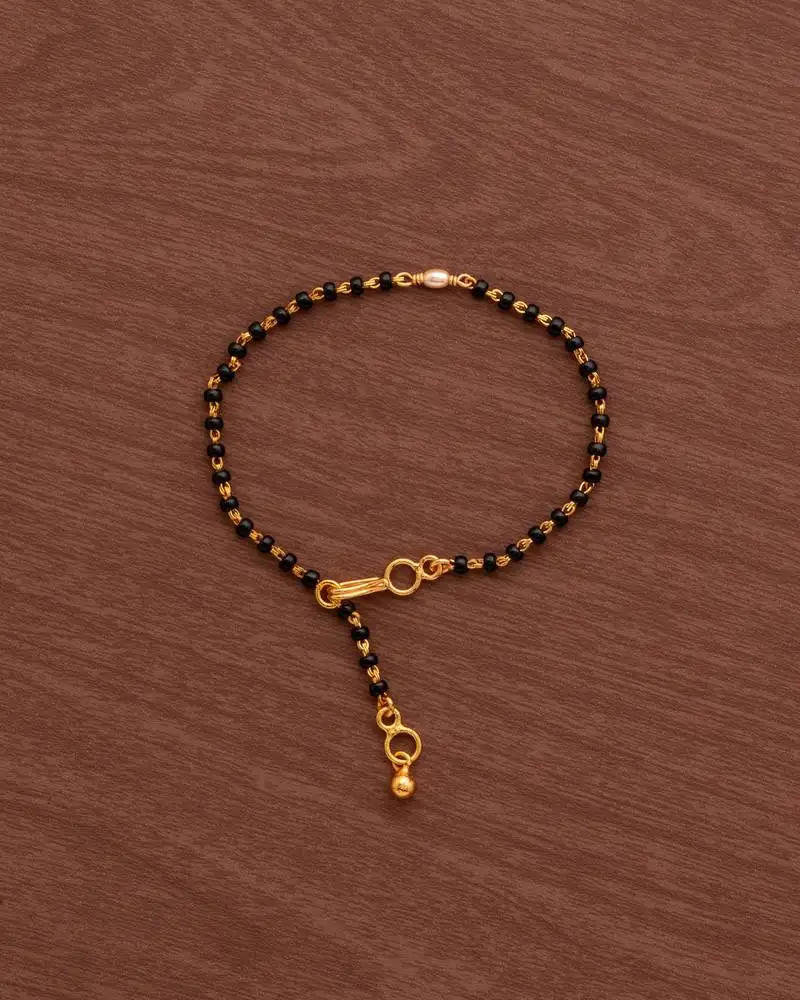Black beads mangalsutra bracelet::Hand mangalsutra with light gold rice pearl one gram gold