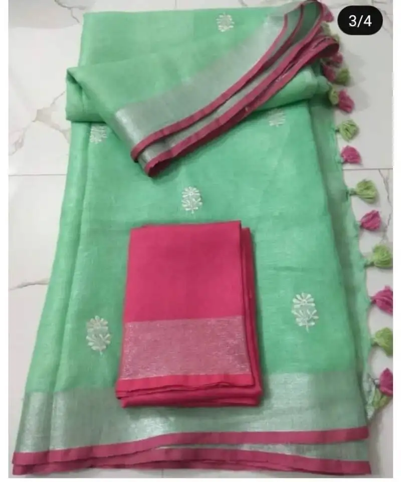 Green handcrafted linen saree with embroidery work on the saree