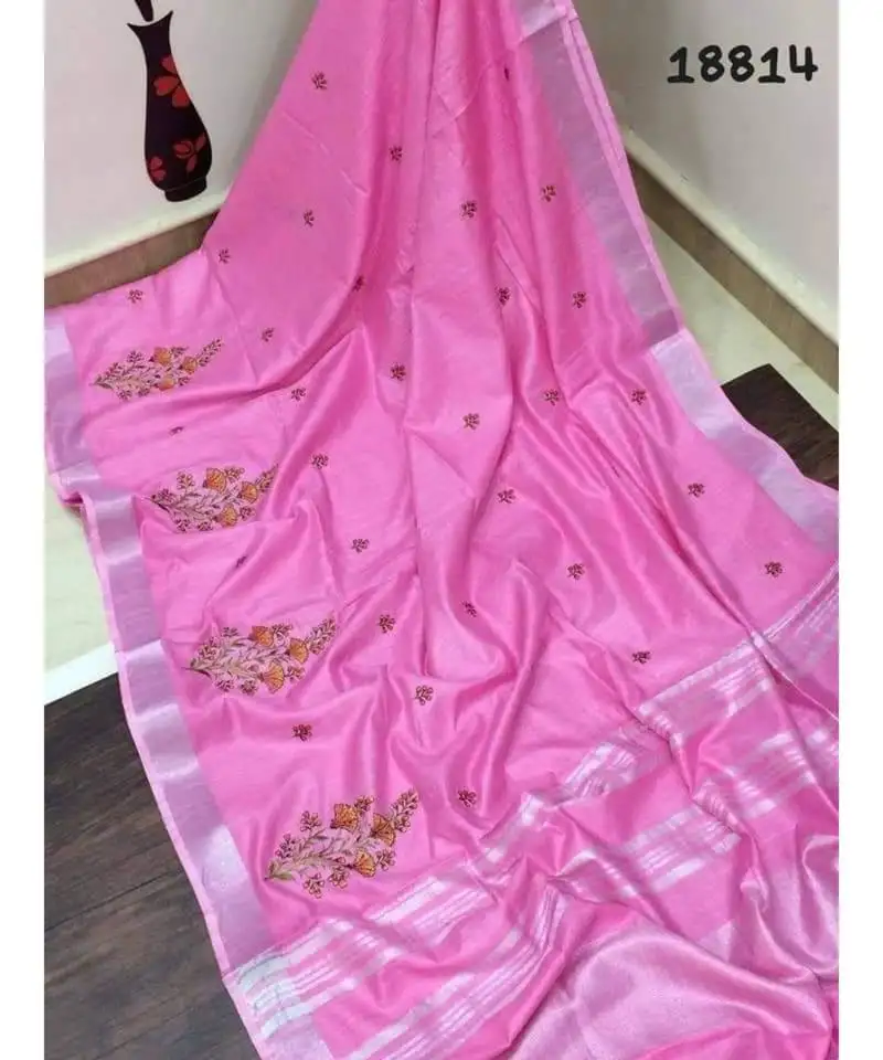 Pink handcrafted linen saree with embroidery work on the saree