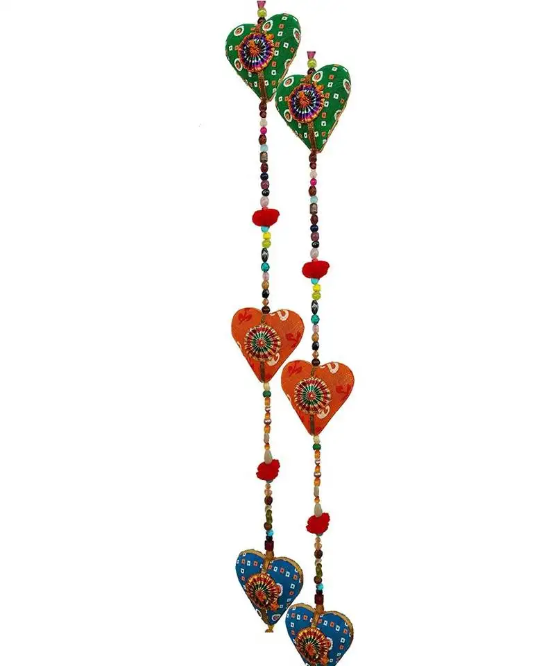 Door hanging ative cotton heart in vibrant color stringed with beads and bell traditional indian hanging atio