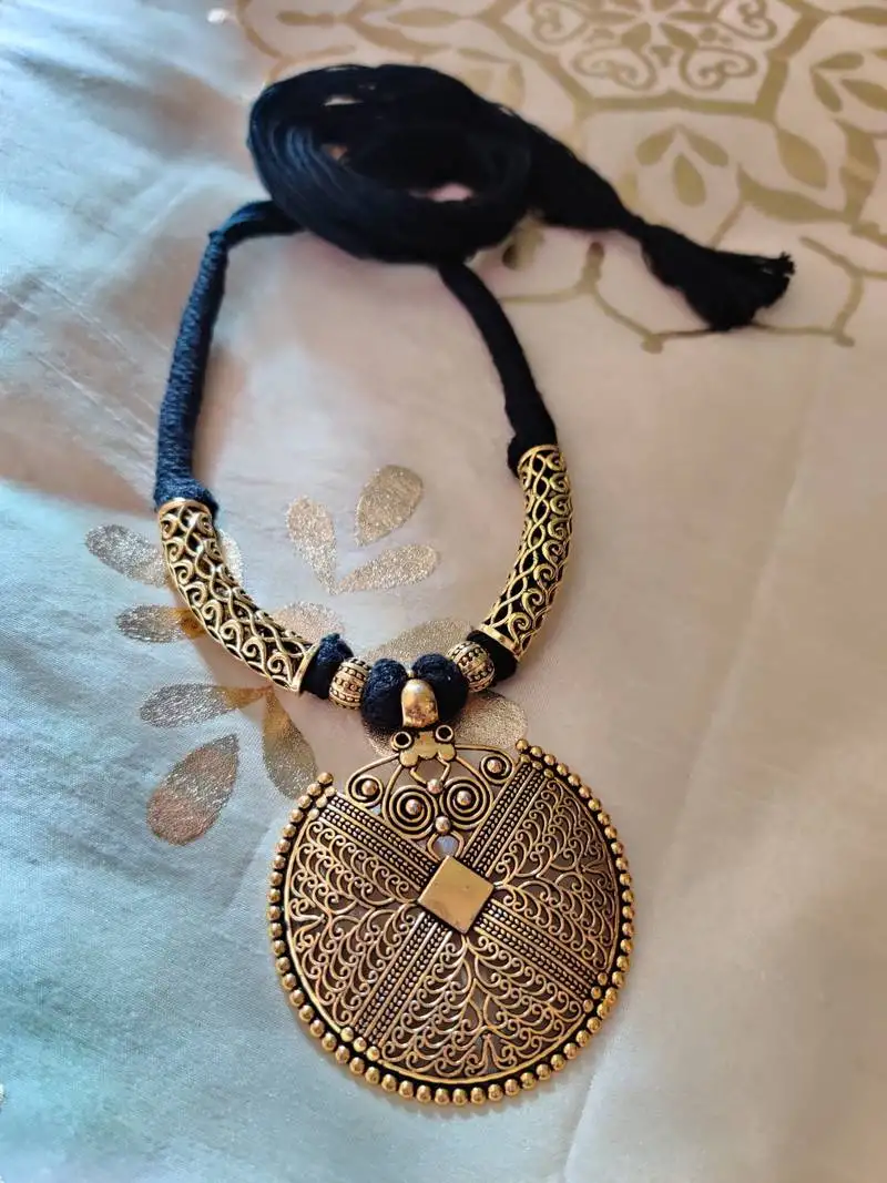 Antique gold plated tassel necklace