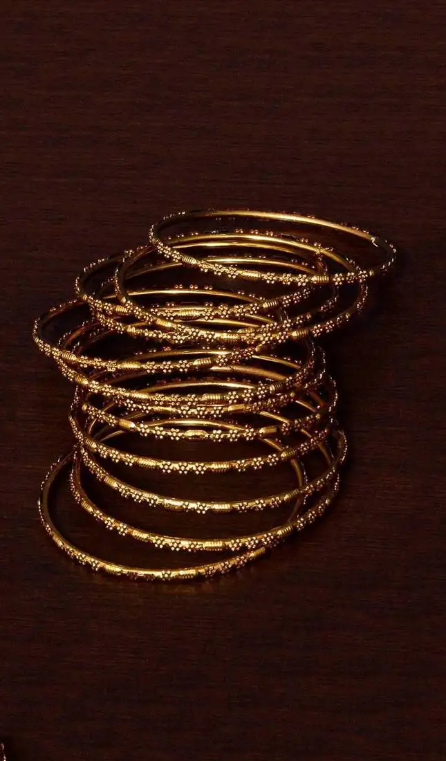 Gold plated set of 12 designer bangles bd385