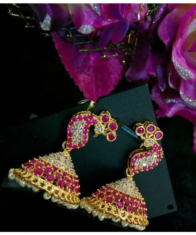 Gorgeous white and red colour stones peacock jumkas