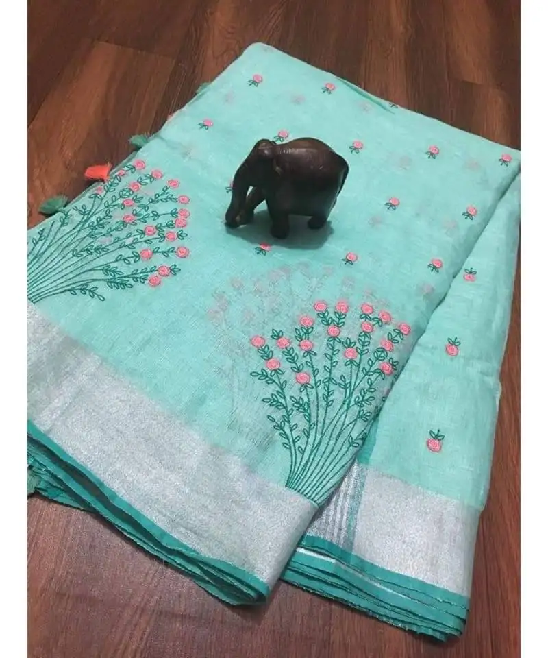Blue handcrafted linen saree with embroiderywork on the saree