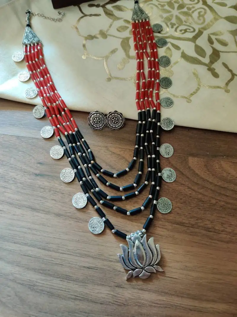 Black and red stone necklace set in lotus pendant
