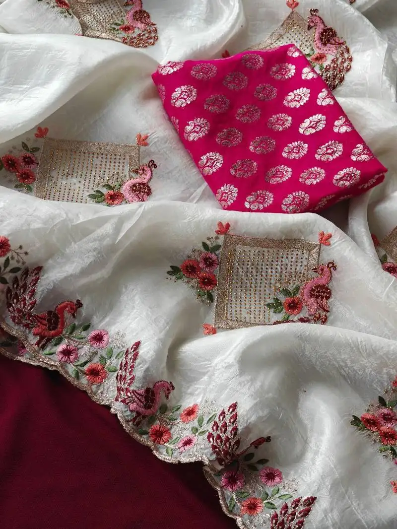 White crush saree blend with beautiful shivroski and zari work with cutwork border and peacock embroidery
