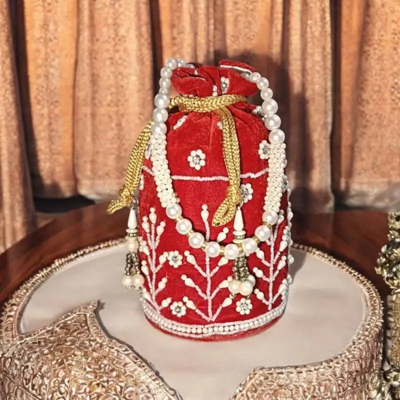 Premium red velvet embroidered potli bag with pearl handle – bridal & festive special