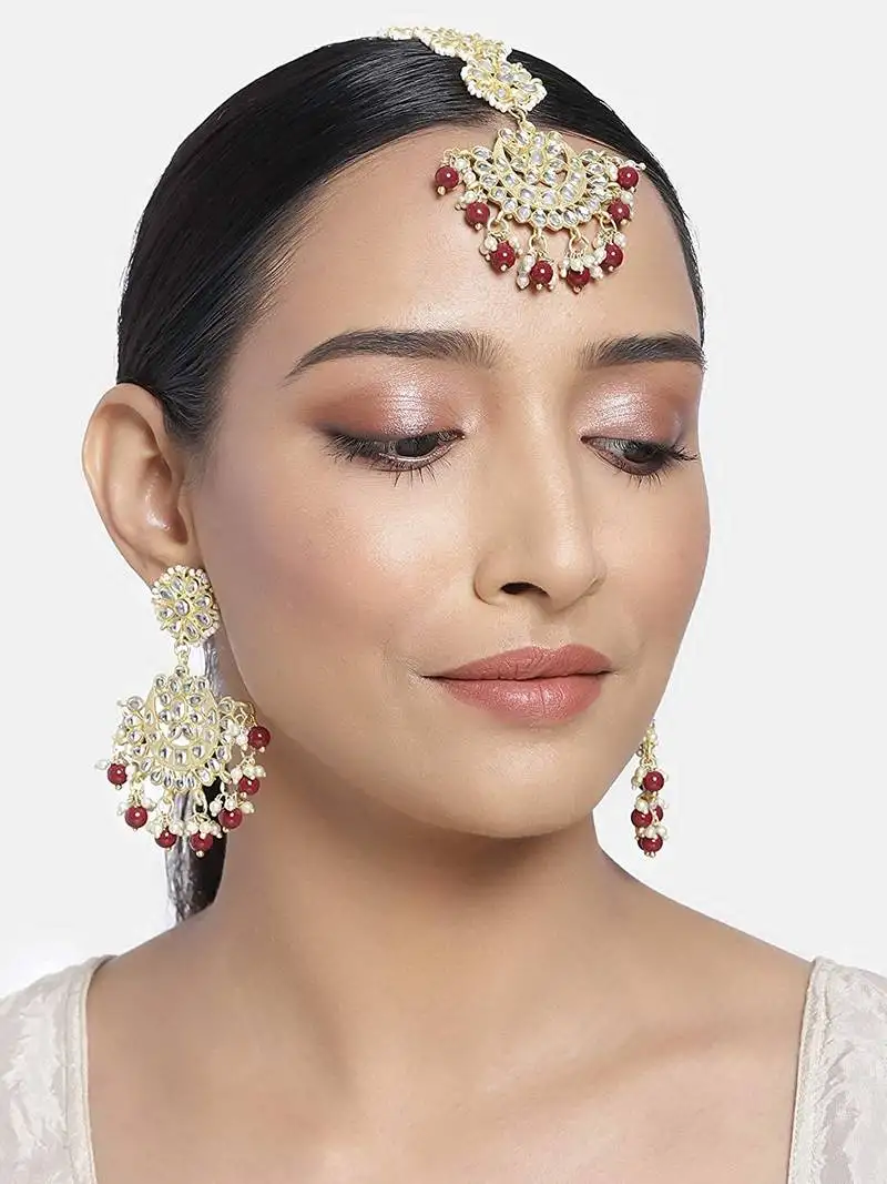 Gold plated with stunning matte finish traditional kundan & faux pearl chandbali earrings with maang tikka set