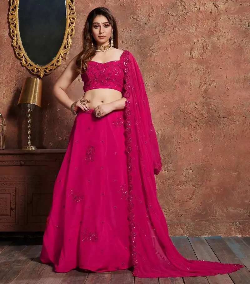 Eye catching romantic rani pink zari, sequins, and dori embroidered georgette semi stitched party wear lehenga